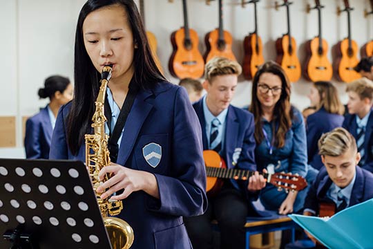 Student having music tuition